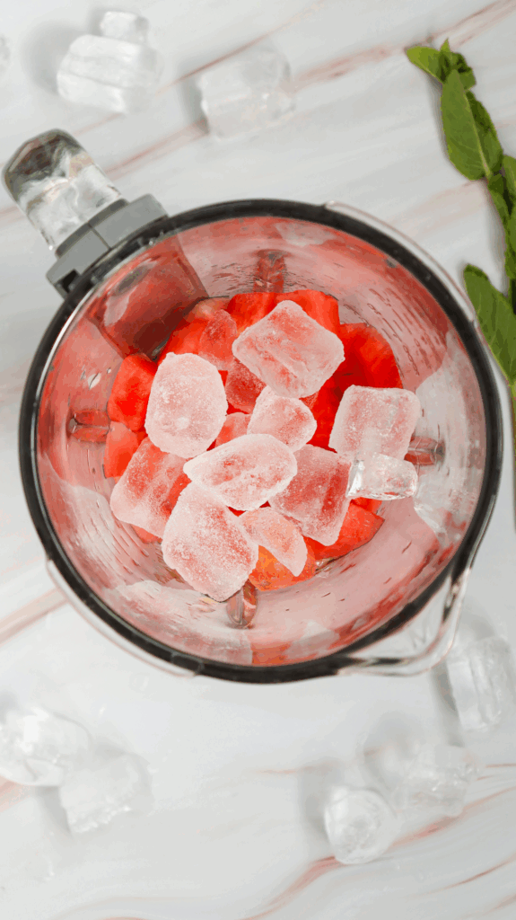 A black background with a black square, accented by a splash of vibrant watermelon slushie color for contrast.